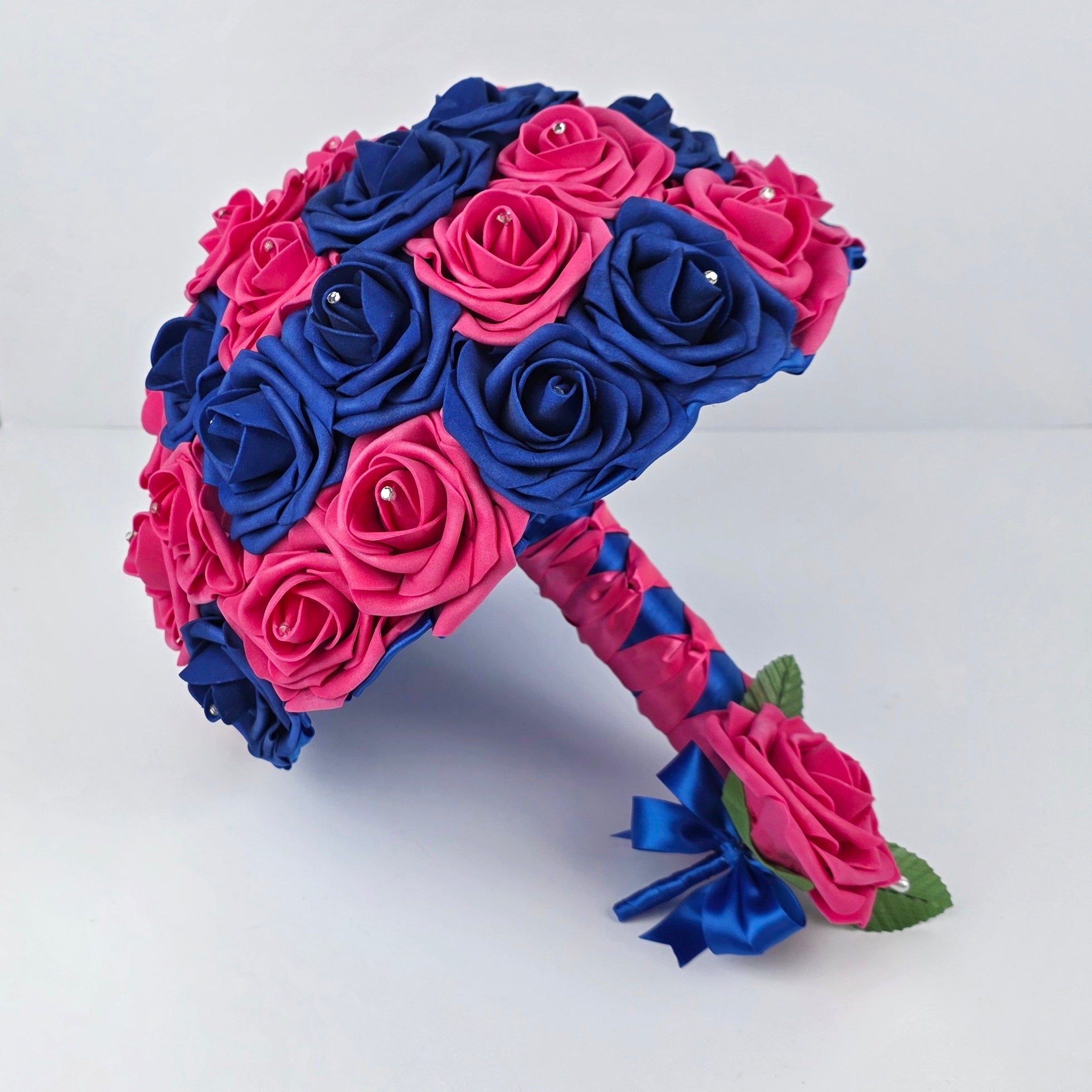 Hot pink and royal blue 10-inch bouquet with matching hot pink boutonniere with royal blue ribbon