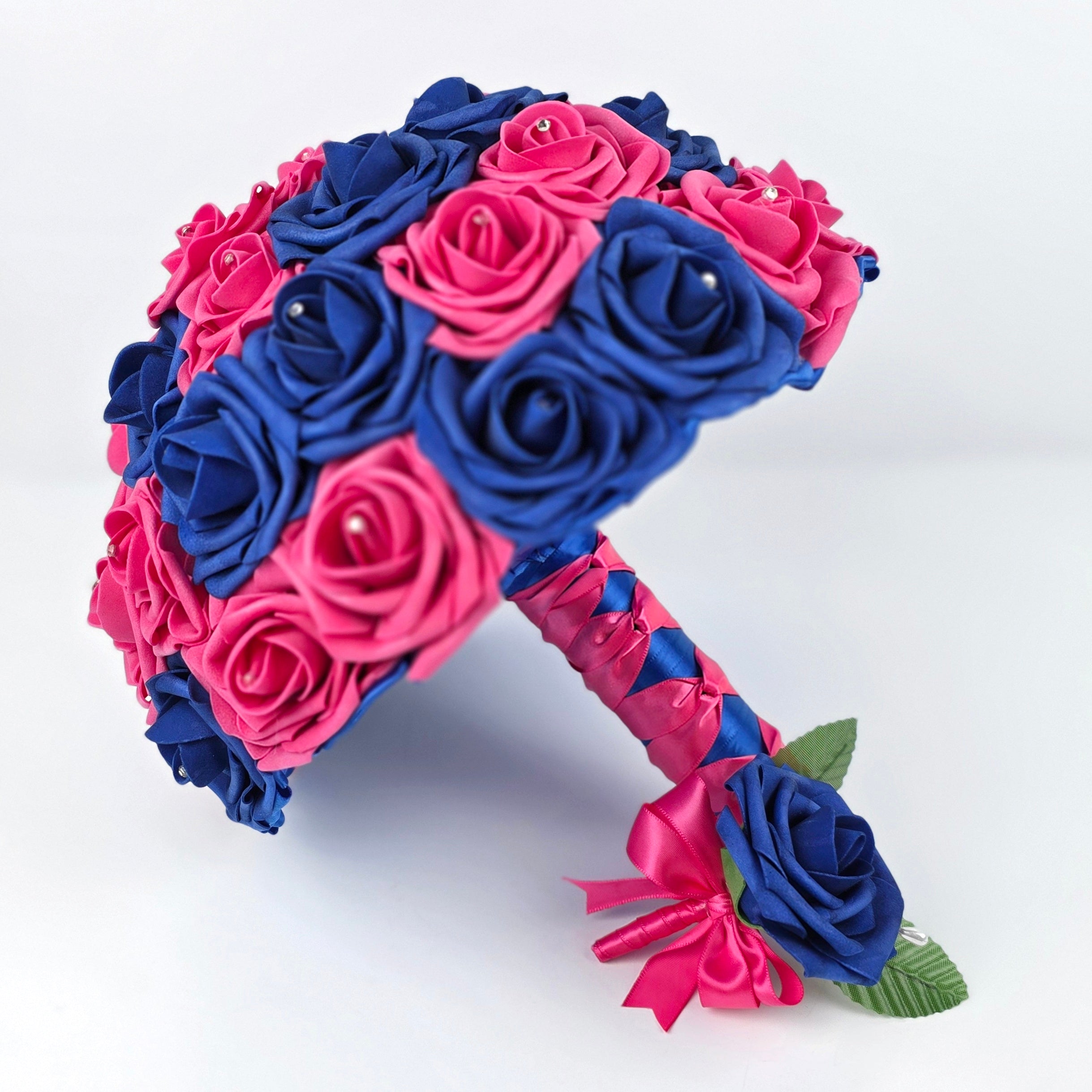 Royal blue and hot pink bouquet and matching boutonniere