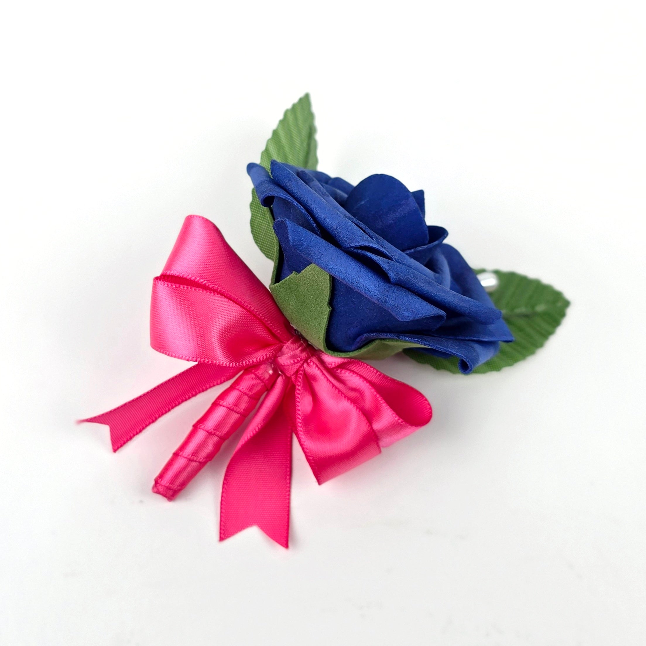 Royal blue boutonniere with hot pink ribbon