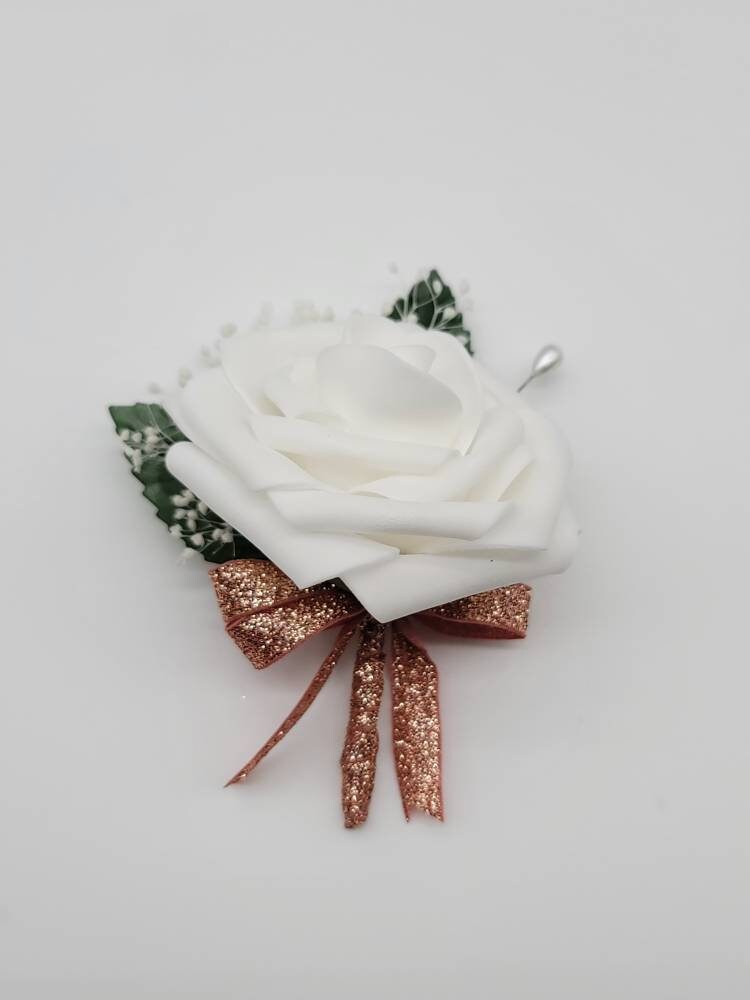 White Rose boutonniere with rose gold ribbon and baby's breath
