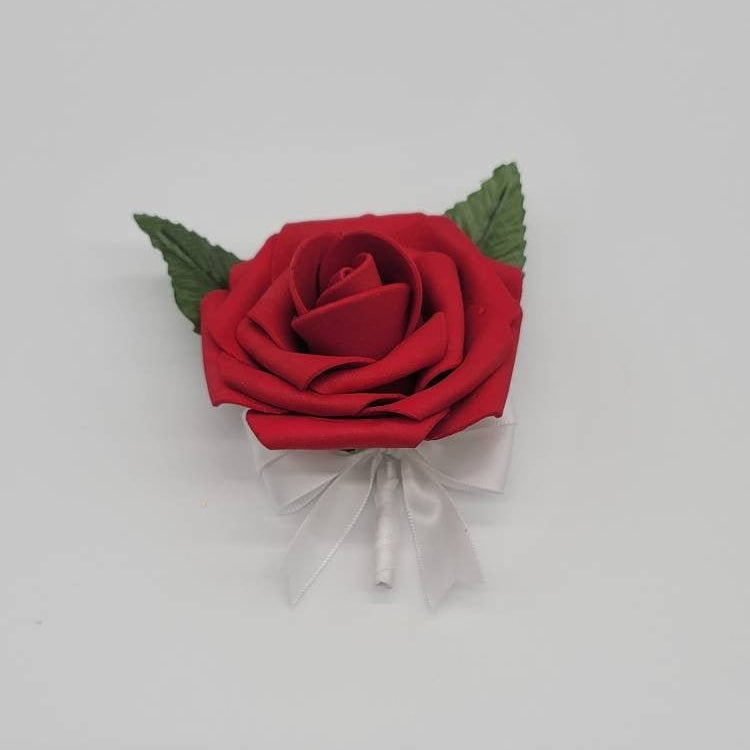 Red rose boutonniere with satin white ribbon made with Real touch roses. faux leaves and pearl pin