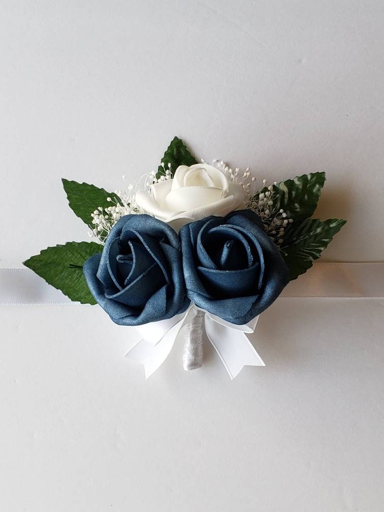 White and dusty blue corsages And Boutonnieres, Available In 27 Colors, Corsages Available In Pin On And Wrist, Matching Bouquets Available