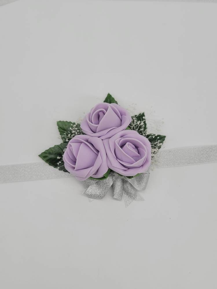 lilac and silver corsages and Boutonnieres,Available In 27 Colors, Corsages Are Available In Pin On And Wrist, Matching Bouquets Available