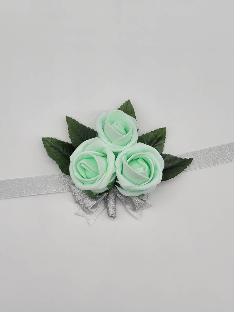 Mint and silver Boutonnieres And Corsages,Available In 27 Colors, Corsages Are Available In Pin On And Wrist, Matching Bouquets Available