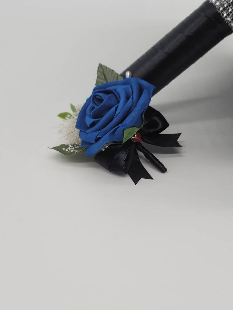 Vegas themed Blush and Ivory Boutonnieres and Corsages with Eucalyptus and card suites. Matching Wedding Bouquets Available