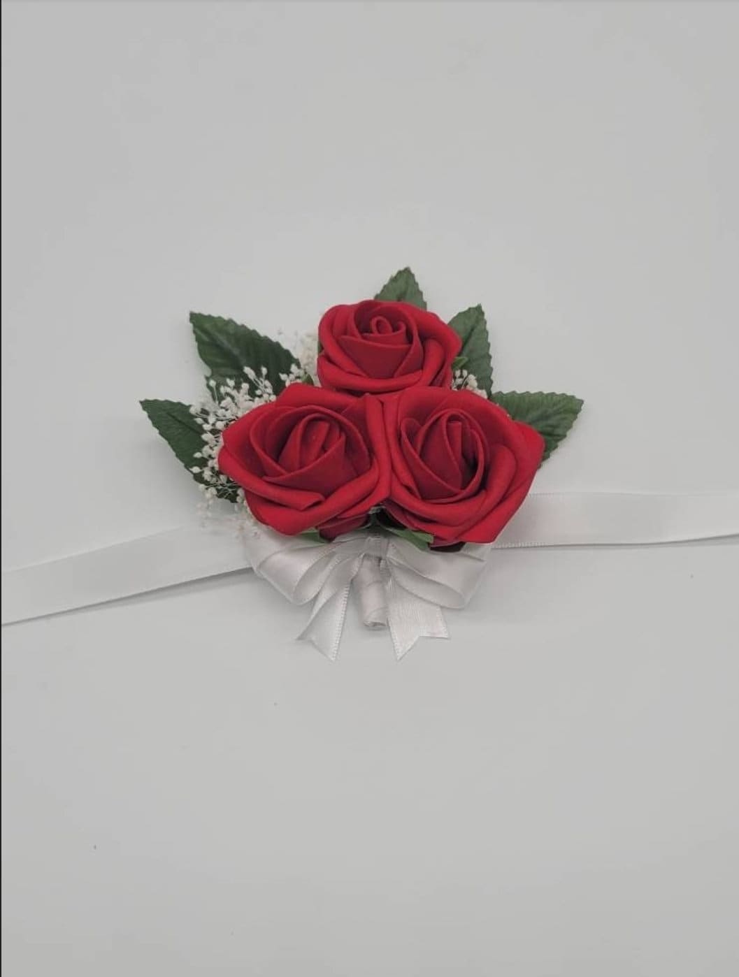 Red, black, and white wedding bouquet made with real touch roses. Bridal bouquet, bridesmaid bouquet, and matching boutonnieres and corsages