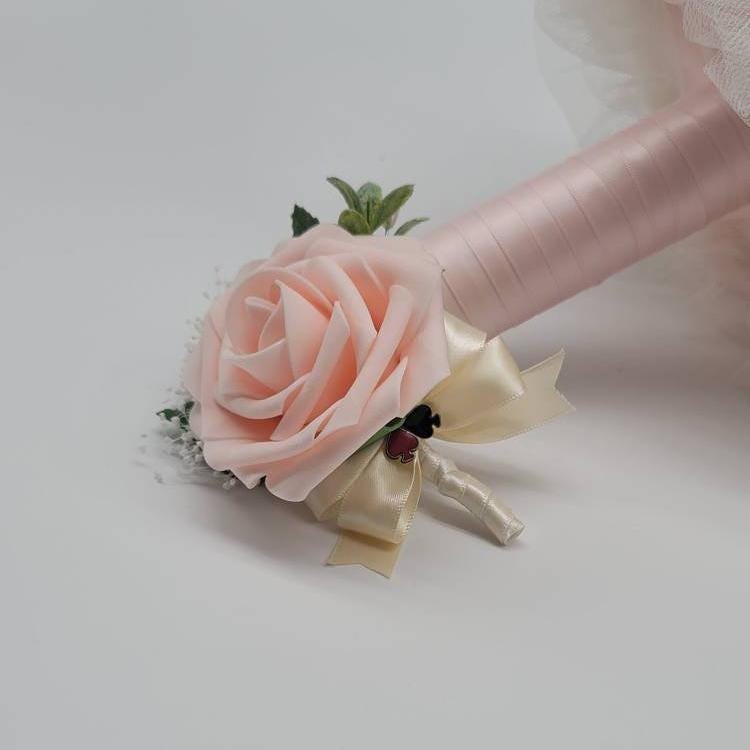 Vegas themed Blush and Ivory Boutonnieres and Corsages with Eucalyptus and card suites. Matching Wedding Bouquets Available