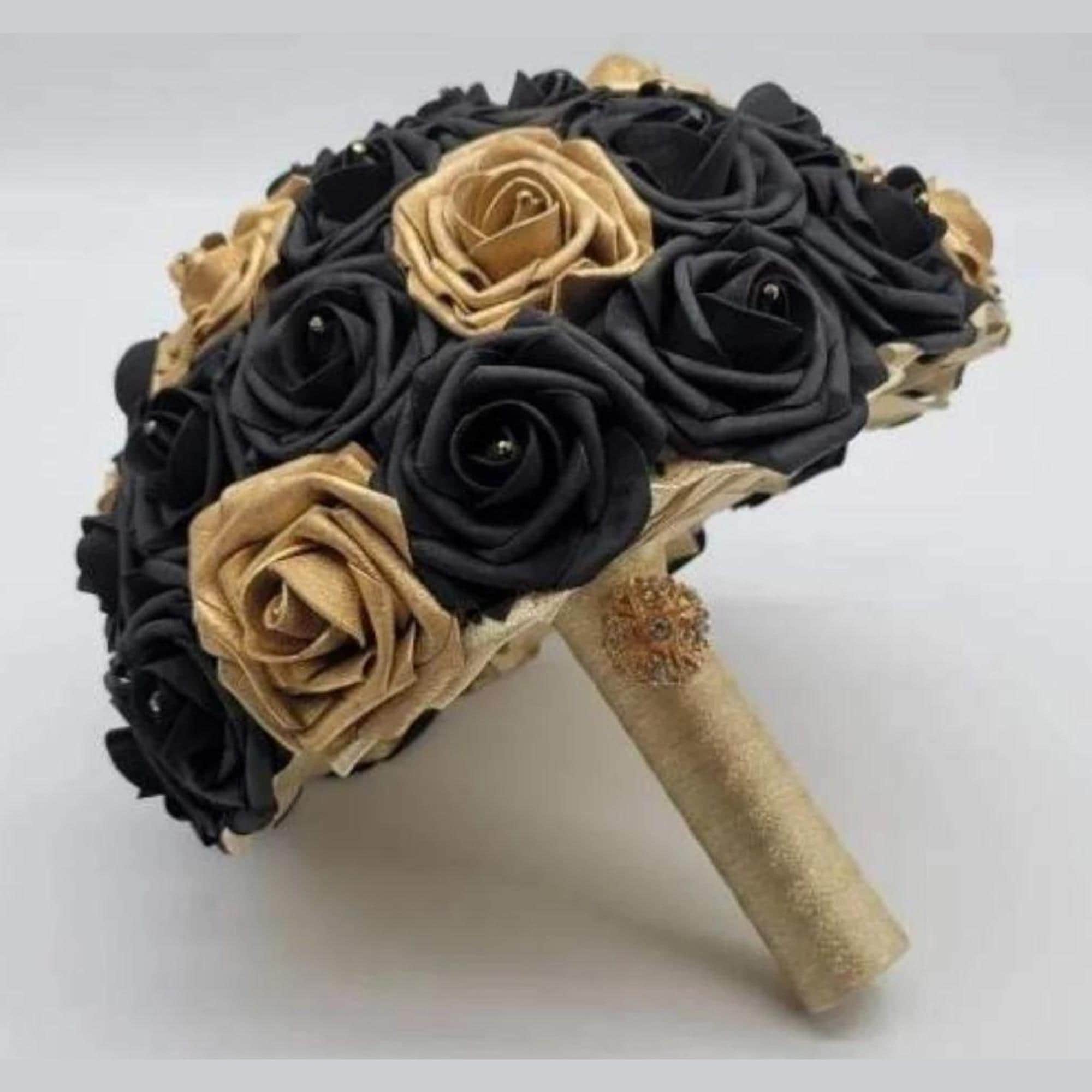 Black and Gold bridal bouquet with gold ribbon and gold brooch. Made with real touch roses. rhinestones on every flower.