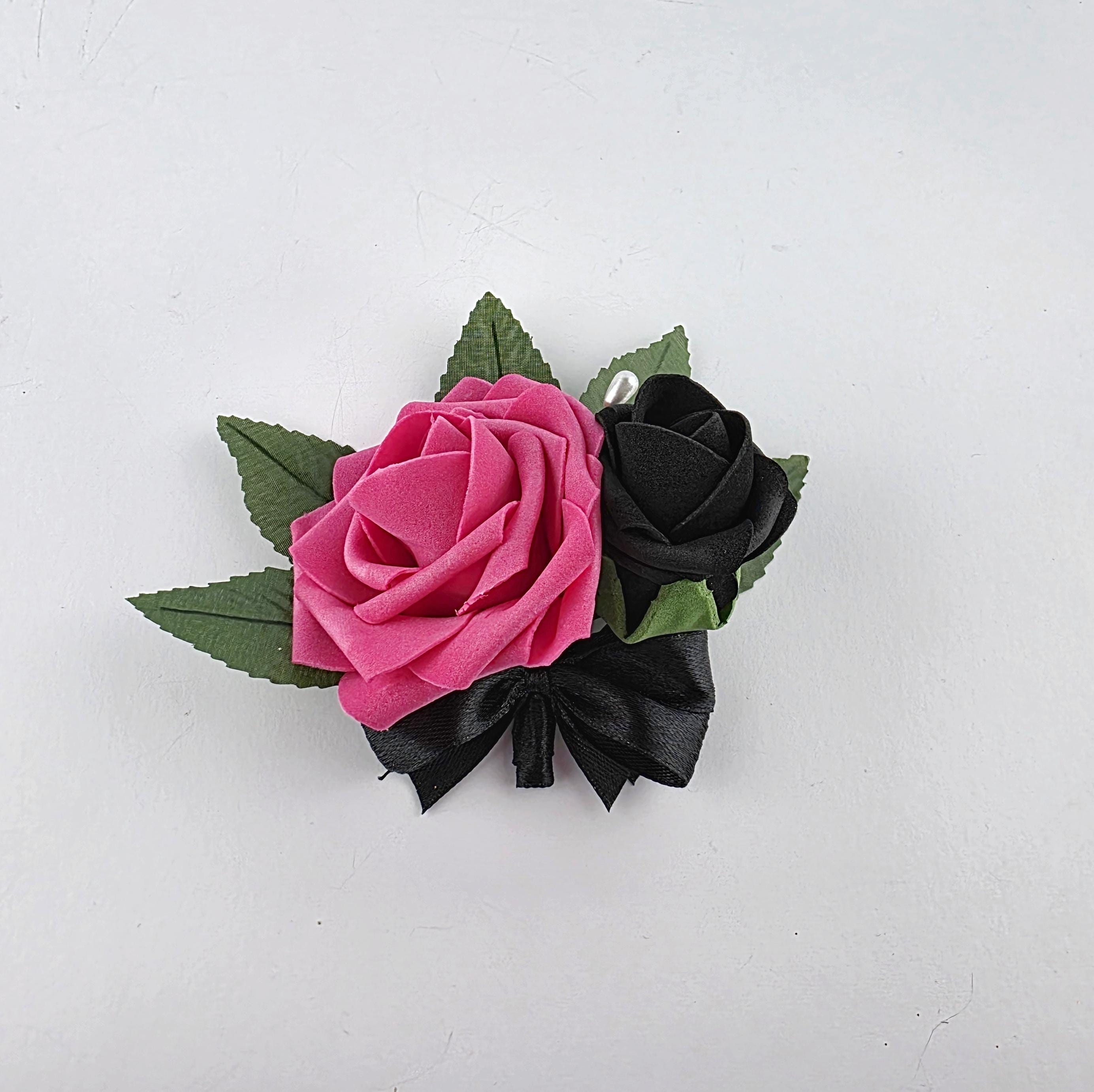 Hot pink and black pin on corsage