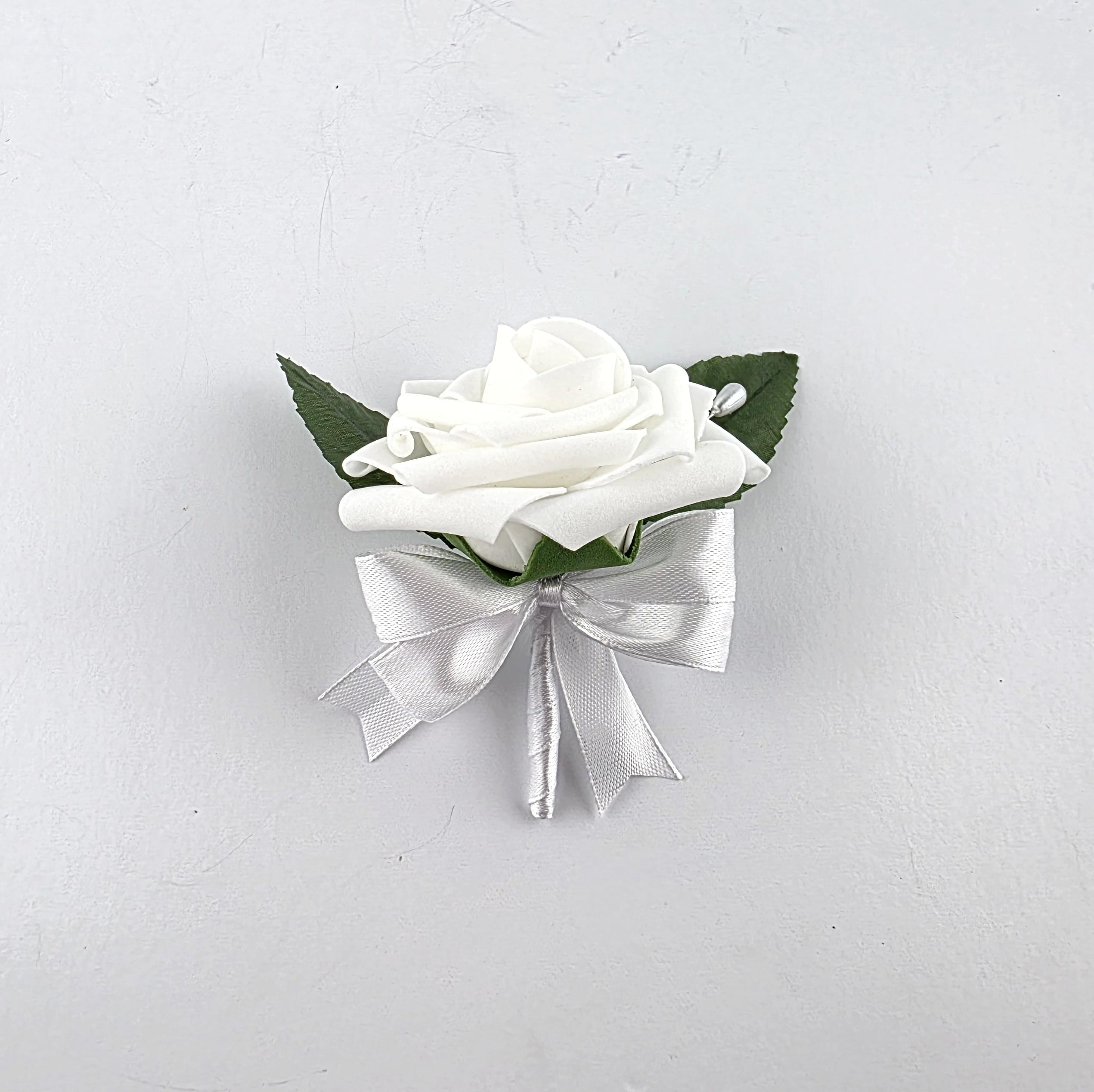 White boutonniere with white ribbon