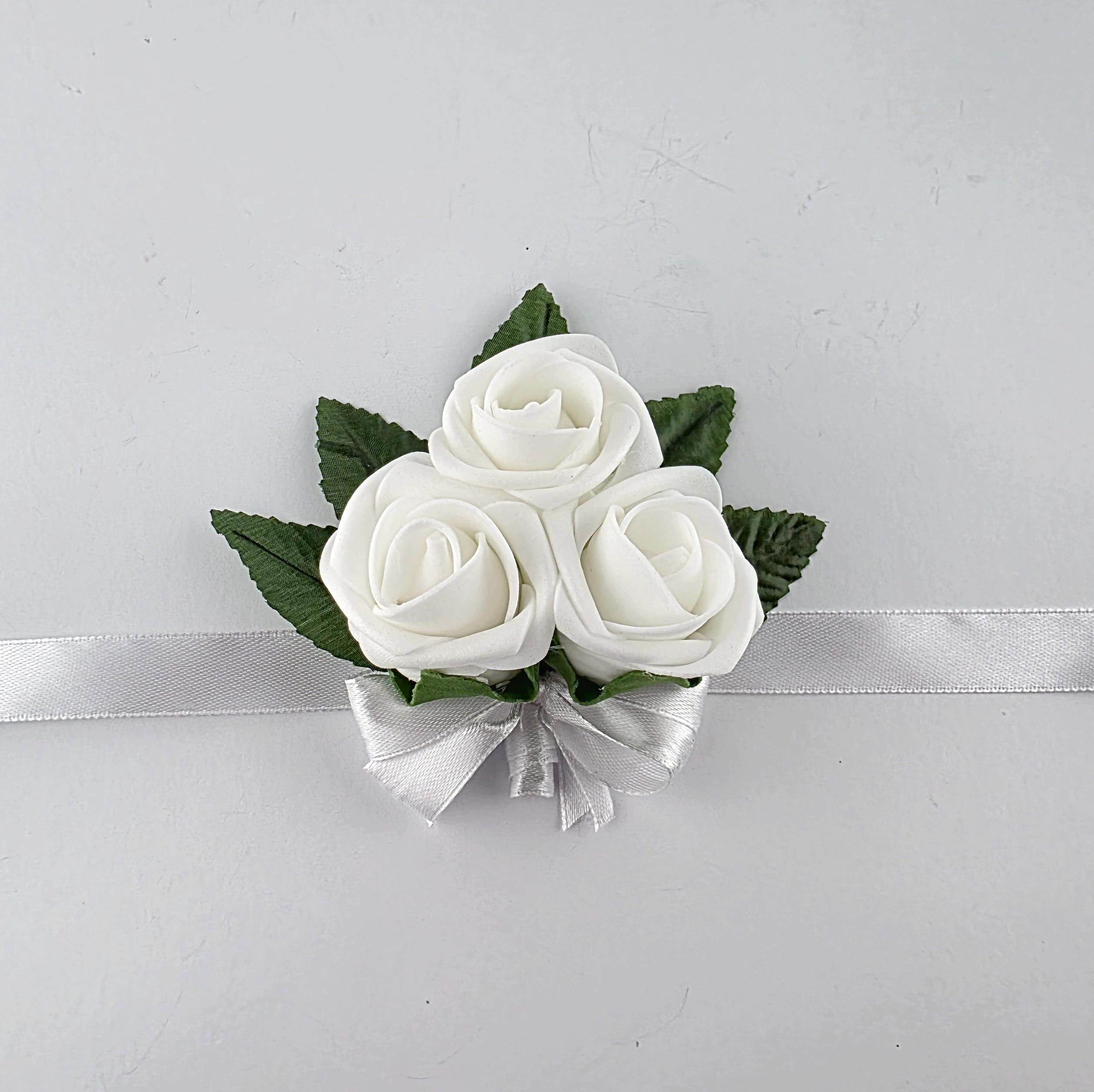 White wrist corsage with 3 flowers