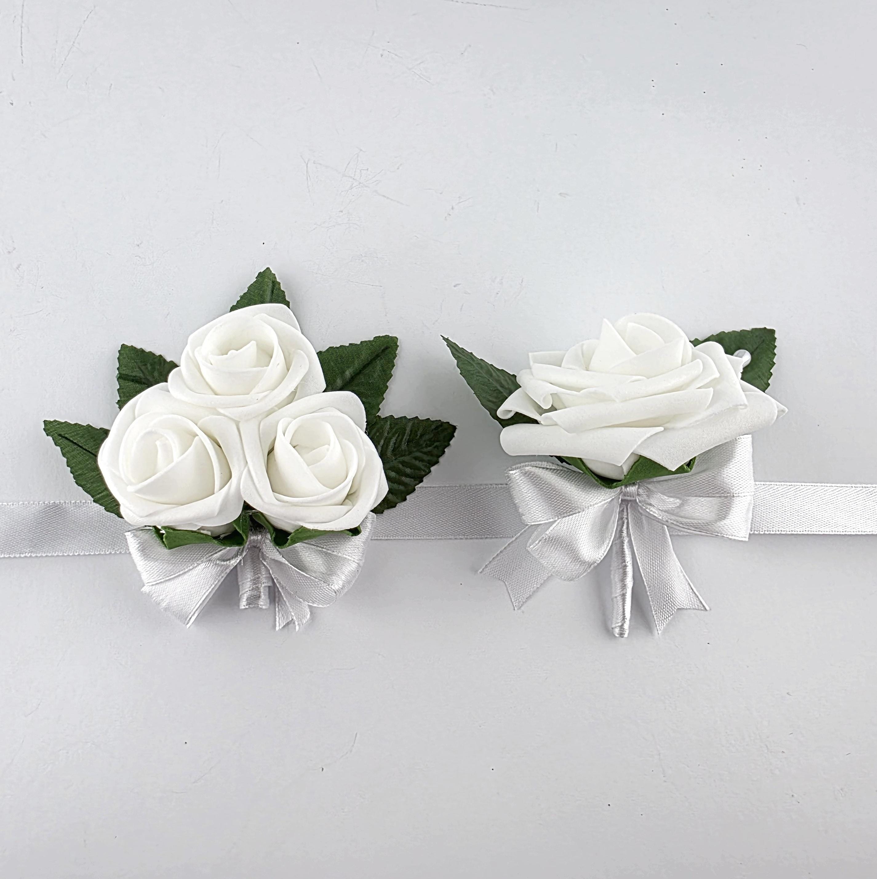 White wrist corsage and boutonniere