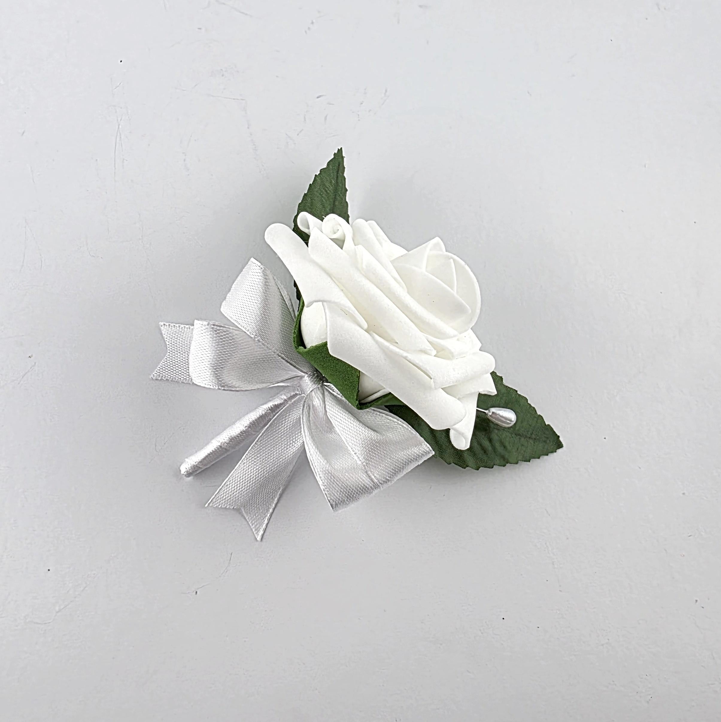White boutonniere with white ribbon