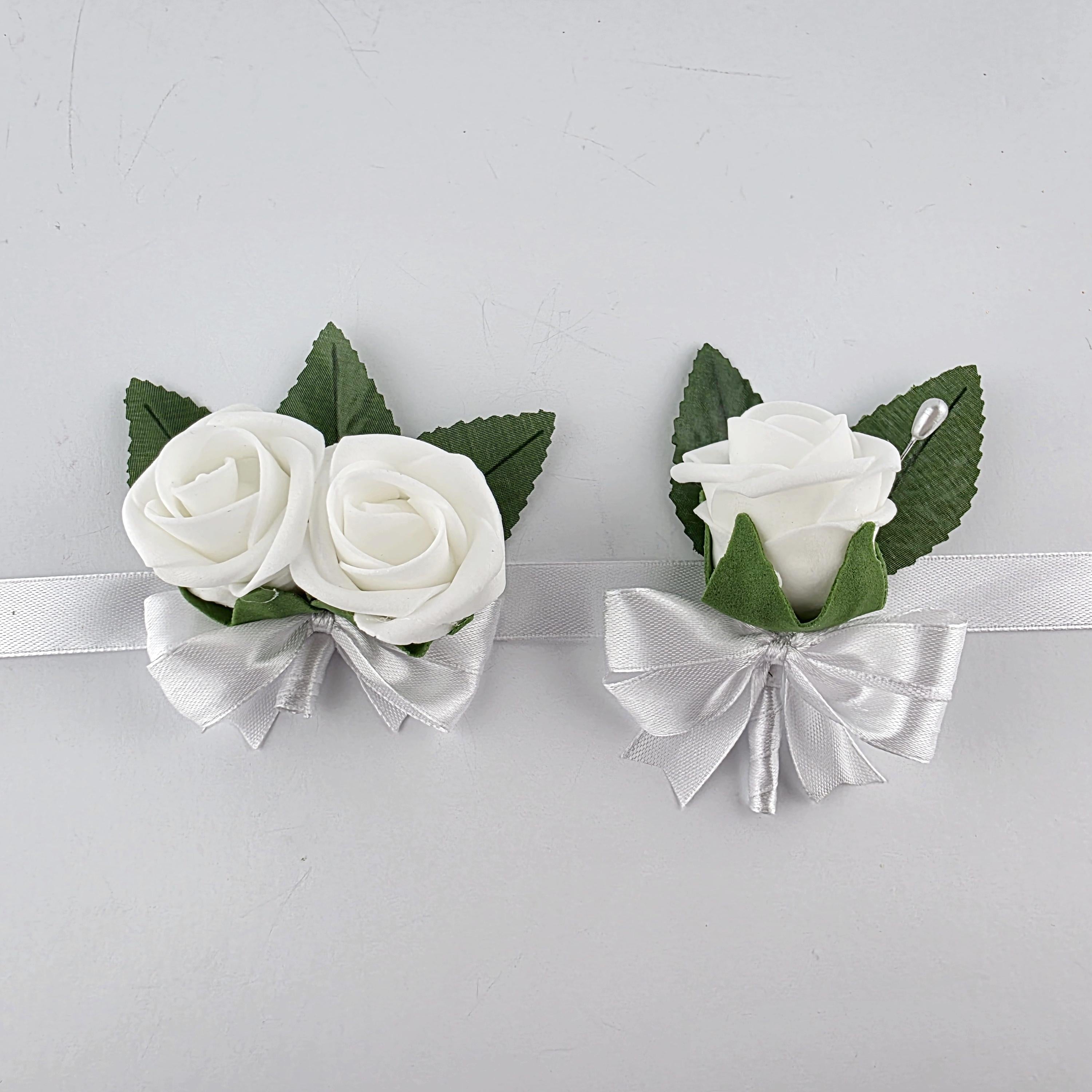 White kids' boutonnieres and wrist corsage