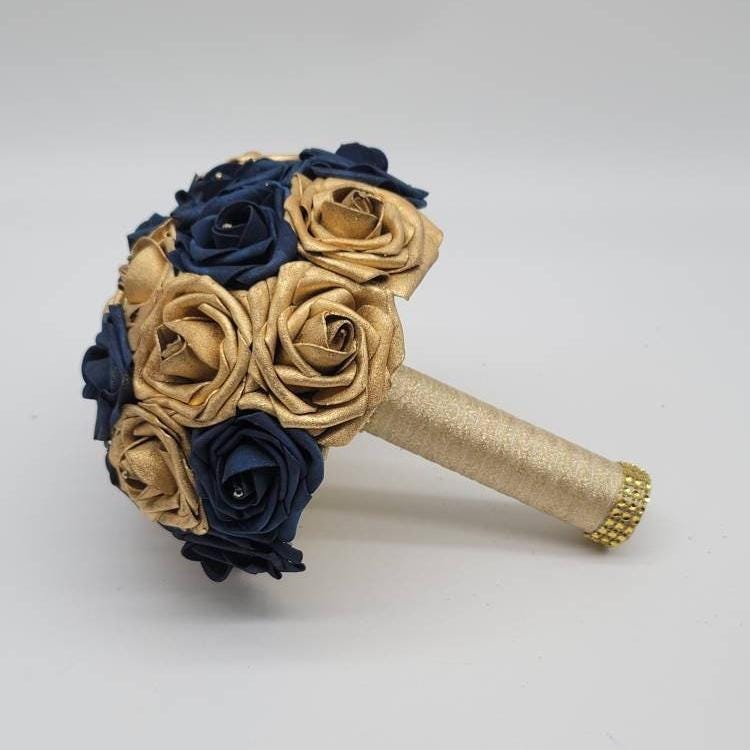 Navy and gold bouquet with gold ribbon. Gold bling wrap on handle.