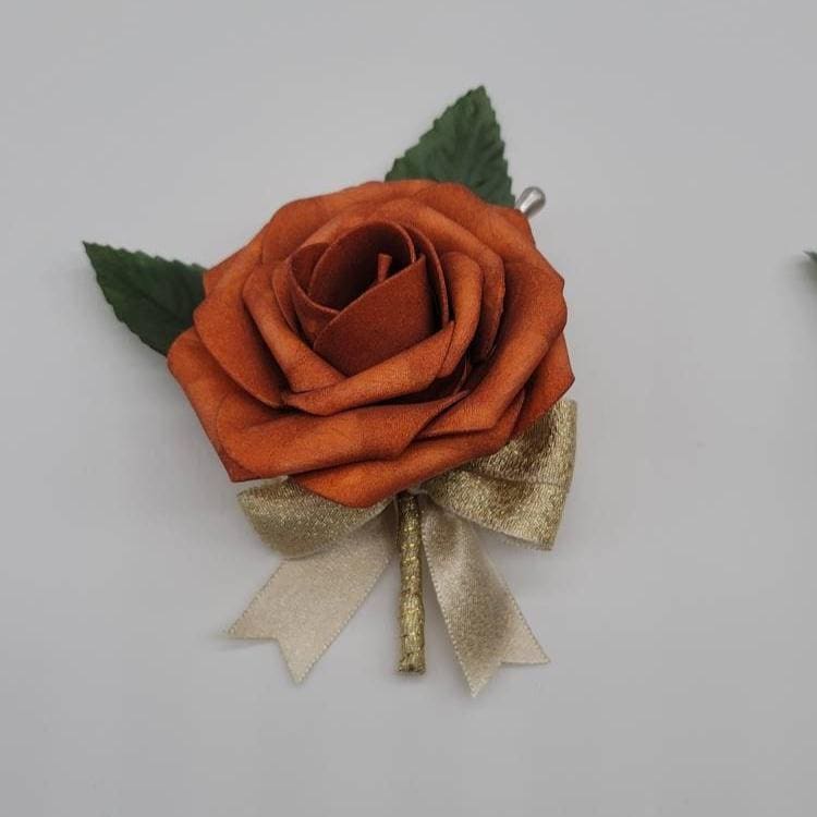 Burnt Orange and gold boutonniere made with real touch roses