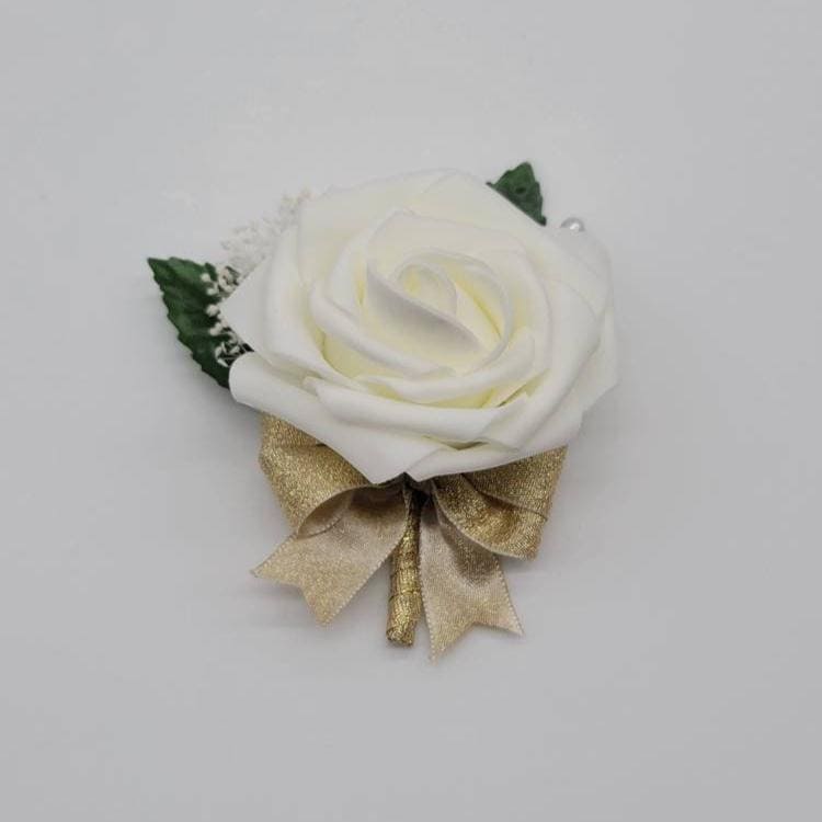 Ivory and gold boutonniere with baby's breath