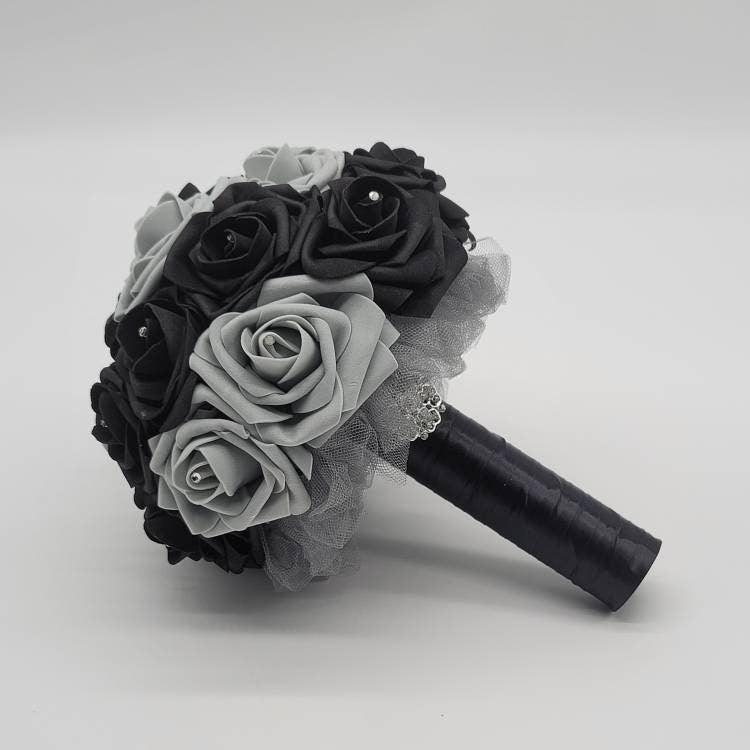 Black and Gray bouquet with rhinestones in every rose. Handle is made up of gray tulle and black satin ribbon and finished with a silver brooch.