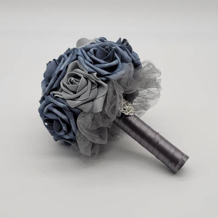 Dusty Blue and gray rose bouquet with rhinestones on every rose. Handle is made up of gray tulle and gray satin ribbon.