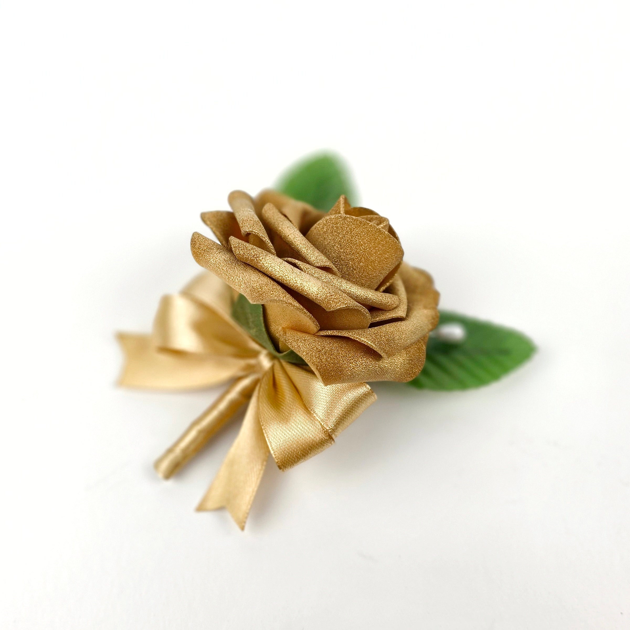 Gold boutonniere with gold ribbon.