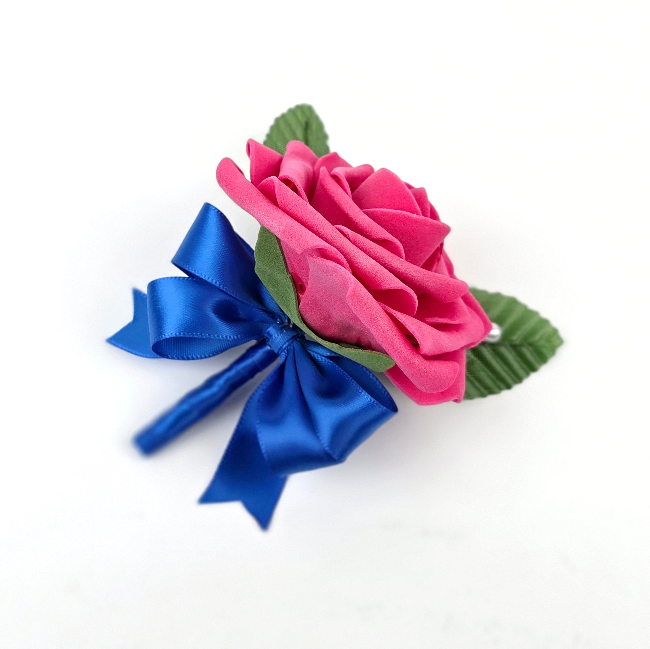 Hot pink Boutonniere with Royal blue ribbon with pin.
