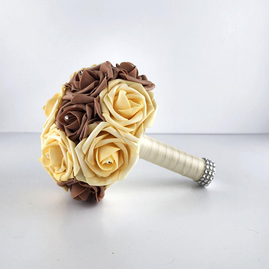 Yellow and mocha mousse brown bouquet with rhinestones in every rose. Handle is made up of ivory ribbon and finished with silver bling wrap.