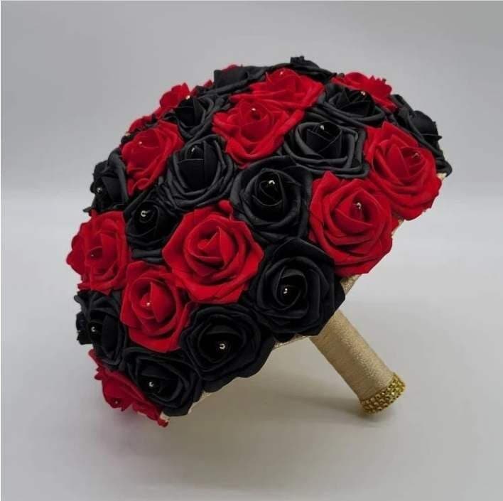 Red and black roses with rhinestones on every rose. Handle is made up of gold ribbon and finished with gold bling wrap.