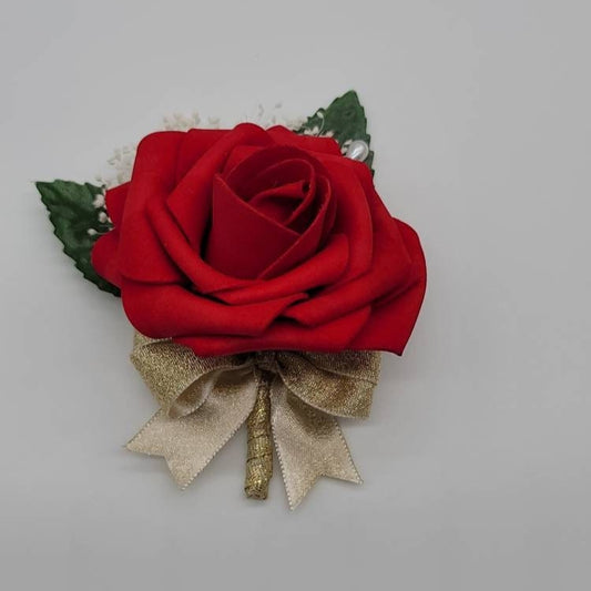 Red rose boutonniere with baby&#39;s breath. 2 Faux leaves and pearl pin. Gold ribbon