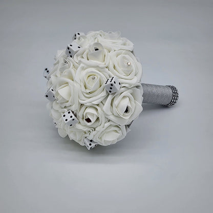 White las vagas bouquet with rhinestones, card suits, and dice scattered throughout bouquet. Handle is made up of silver ribbon