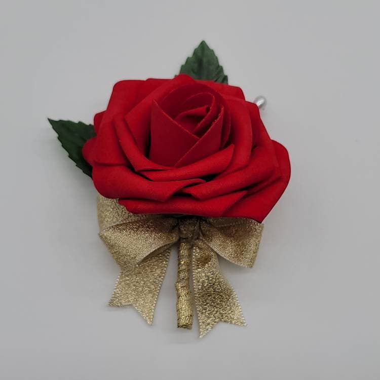 Red rose boutonniere made with real touch roses and gold ribbon finished with a pearl pin