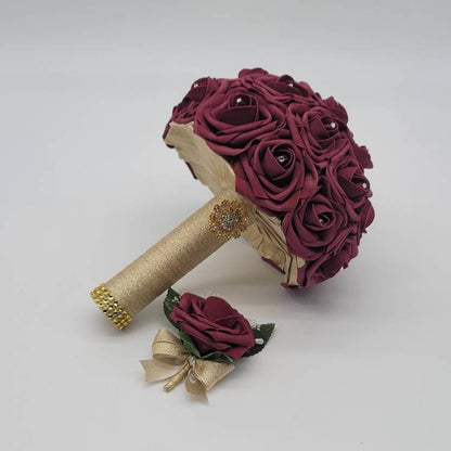 Bouquet with matching Boutonniere. Burgundy rose and gold ribbon