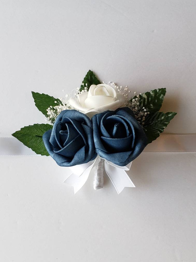 White and dusty blue corsages And Boutonnieres, Available In 27 Colors, Corsages Available In Pin On And Wrist, Matching Bouquets Available