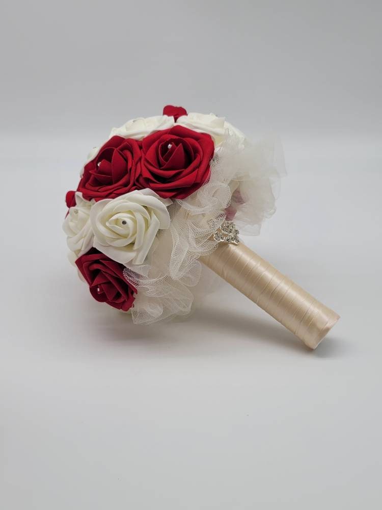 Red and Ivory Wrist Corsage with Baby's Breath and Matching Boutonniere