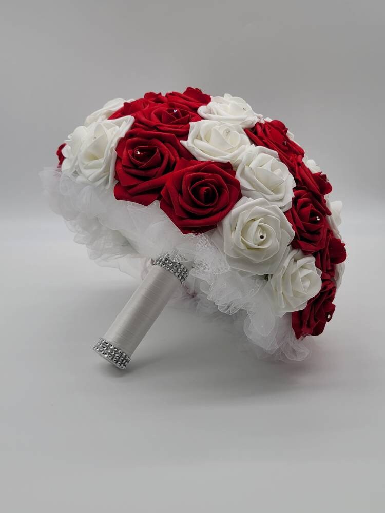 Red and White Wrist Corsage with Baby's Breath and Matching Boutonniere