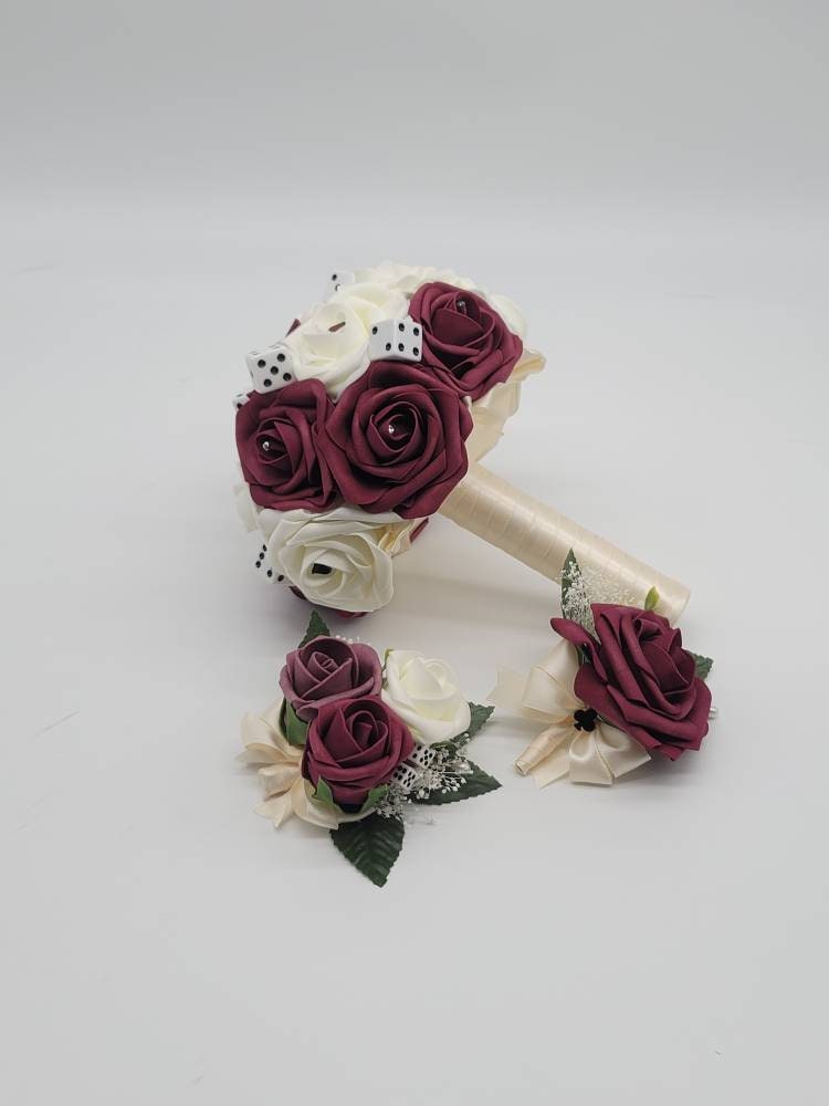 Vegas themed Blush and Ivory Boutonnieres and Corsages with Eucalyptus and card suites. Matching Wedding Bouquets Available