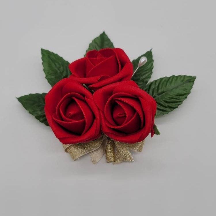 red rose bud pin on corsage with pearl pin and gold ribbon. made with real touch roses and faux leaves.