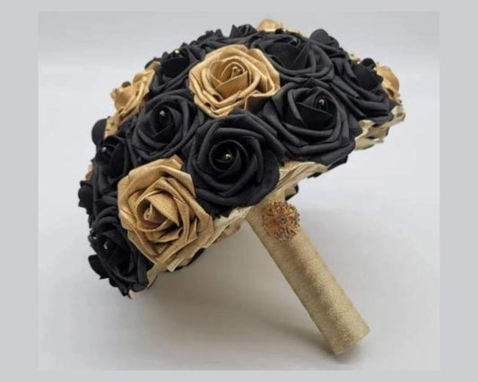 Black and Gold bridal bouquet with gold ribbon and gold brooch. Made with real touch roses. rhinestones on every flower.