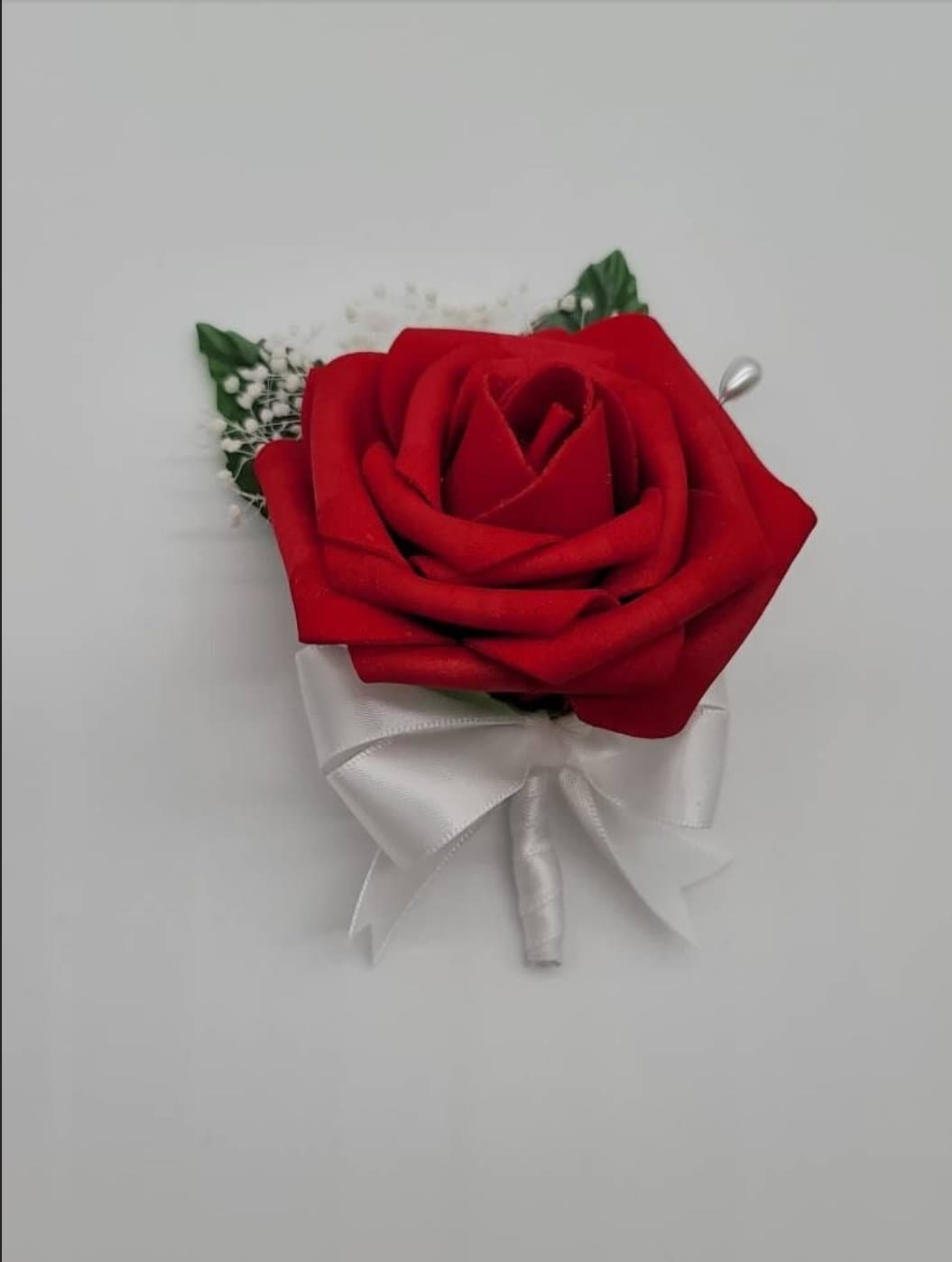 Red, black, and white wedding bouquet made with real touch roses. Bridal bouquet, bridesmaid bouquet, and matching boutonnieres and corsages