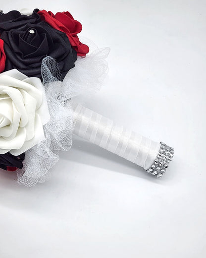 Red, black, and white wedding bouquet made with real touch roses. Bridal bouquet, bridesmaid bouquet, and matching boutonnieres and corsages