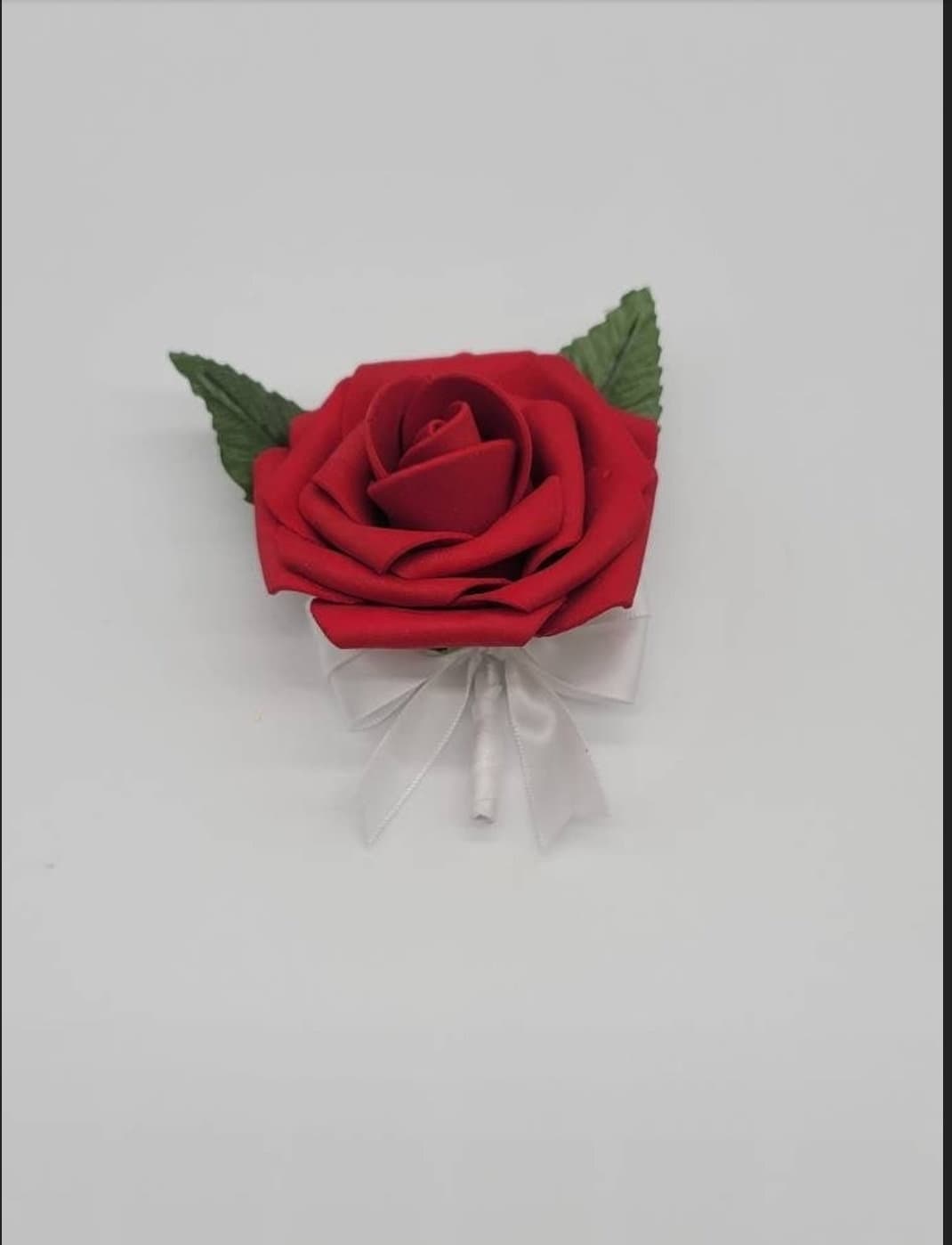Red, black, and white wedding bouquet made with real touch roses. Bridal bouquet, bridesmaid bouquet, and matching boutonnieres and corsages