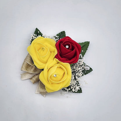 Red and yellow Pin on corsage with baby&#39;s breath and gold Ribbon.