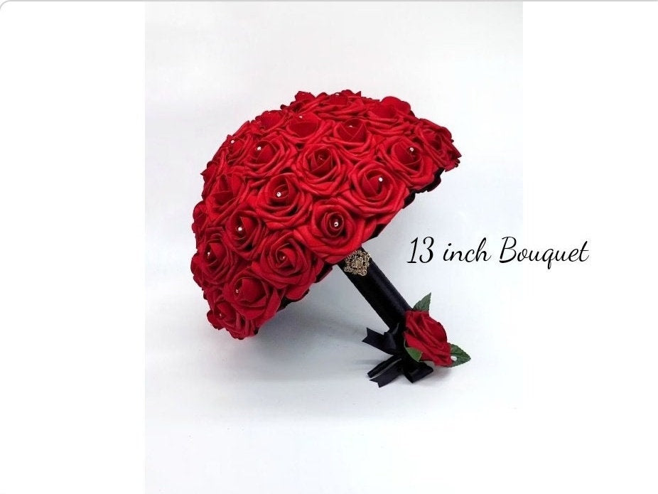 Red rose bouquet with black satin ribbon. Handle is finished with silver bling wrap. Rhinestones are in center of every rose. Matching men's boutonniere with red flower. Great for weddings, brides, bridesmaids, prom, homecoming, Quinceanera's.