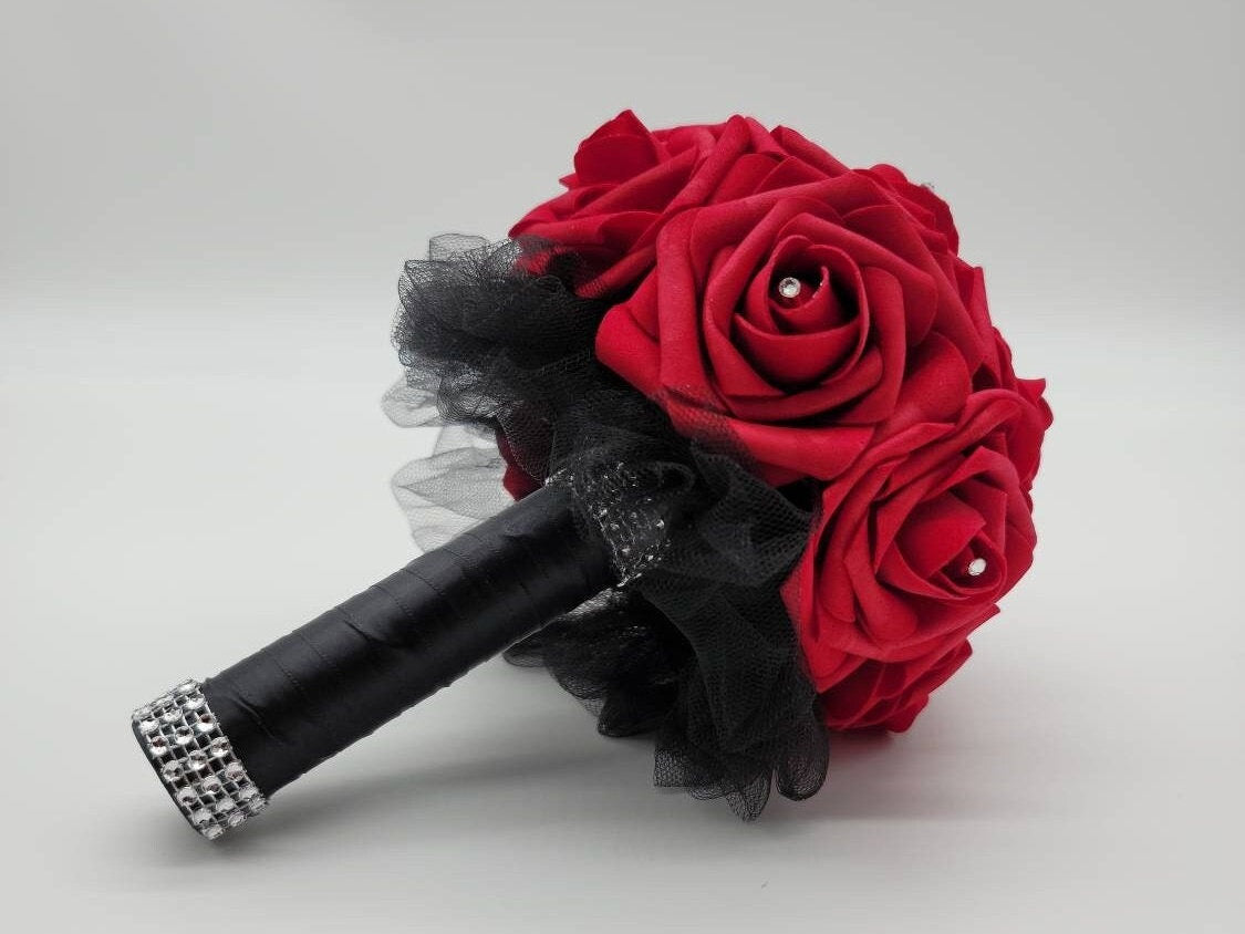 6 inch toss bouquet with red roses. Handle is made using black satin ribbon and finished with silver bling wrap. rhinestones are in the center of Evey rose. Great for Bridal bouquets, Bridesmaid bouquets, Prom, Homecoming, Quinceanera&#39;s