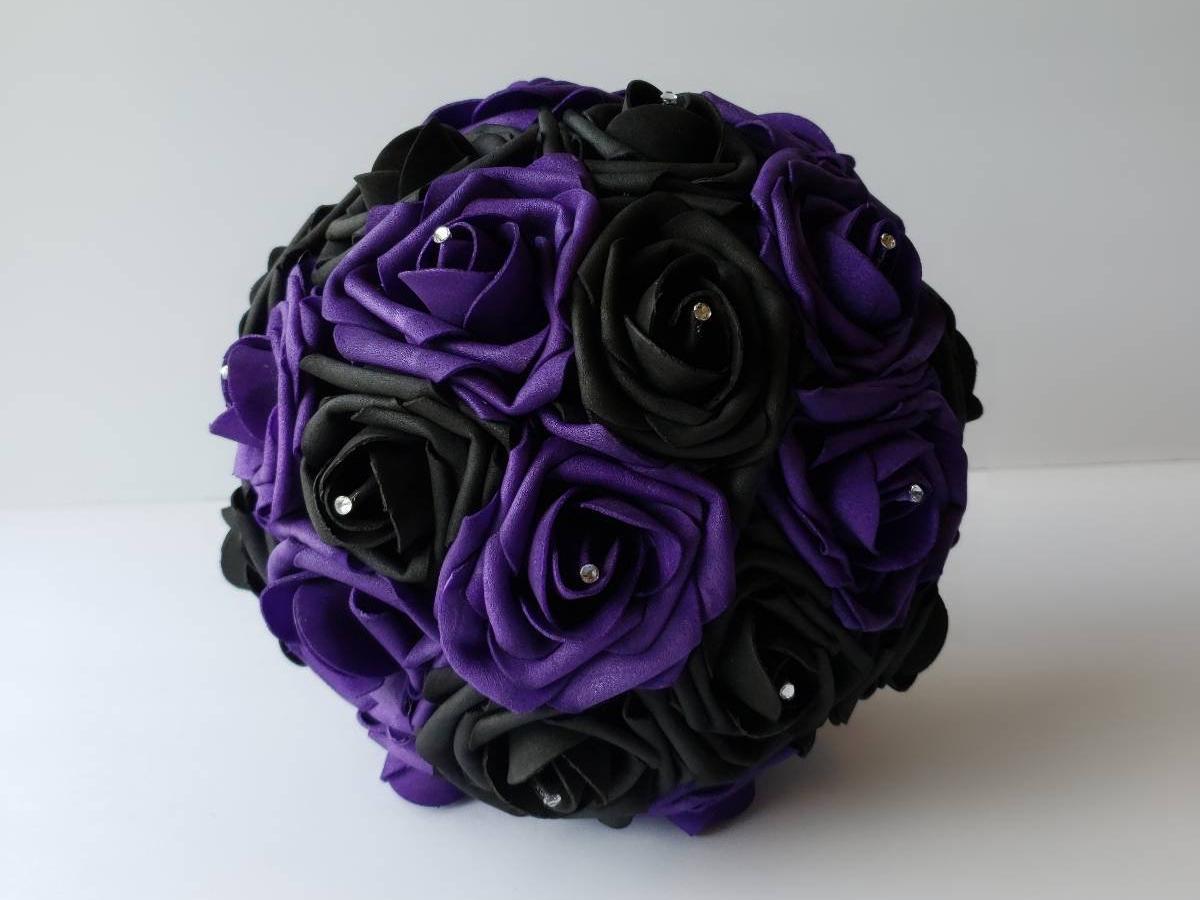 A purple and black Real Touch rose bouquet with rhinestones.