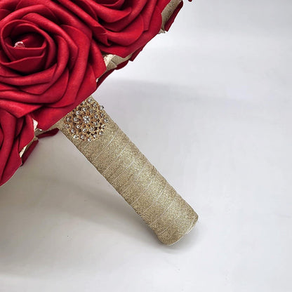 Picture of handle made up of gold ribbon and finished with a gold brooch.