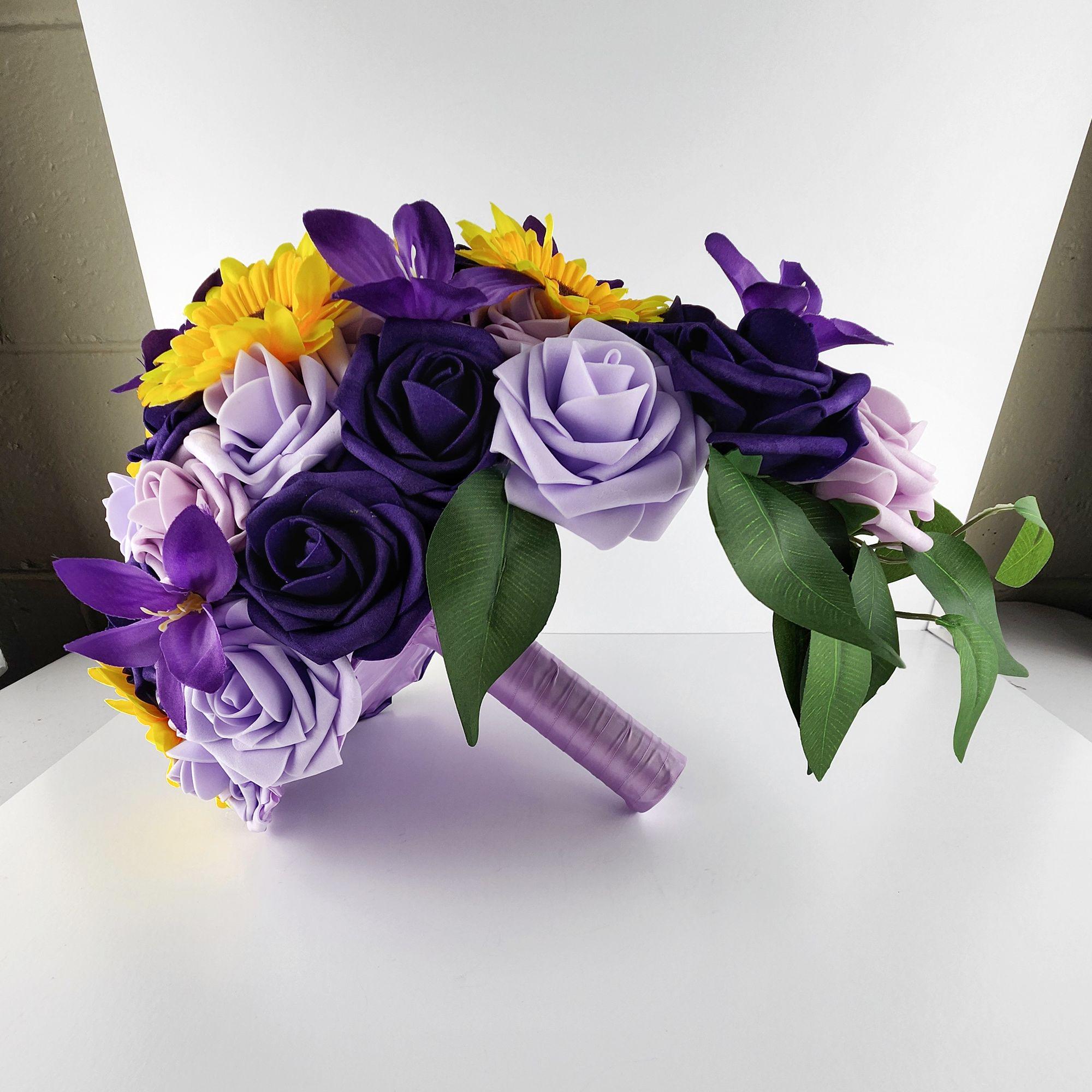 Side view of bouquet laying down. shows the arch of the cascade and greenery.