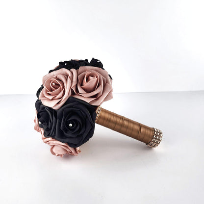 Dusty Rose and Black Wedding Bouquet with rhinestoneson every rose. Handle is made up of champaign ribbon and finished with rose gold bling wrap.