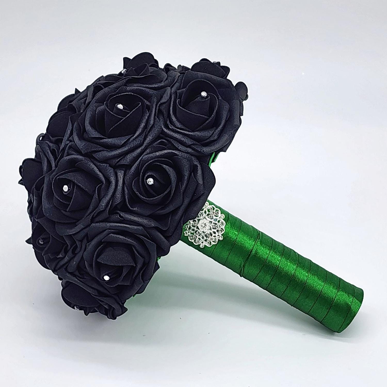Black wedding bouquet made with real touch roses. Rhinestones on every rose. handle is made out of green satin ribbon and finished with silver brooch