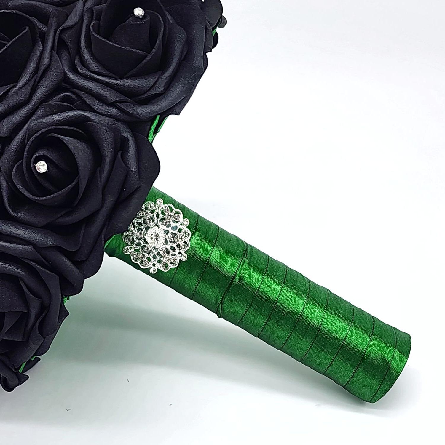 Emerald green handle with silver brooch