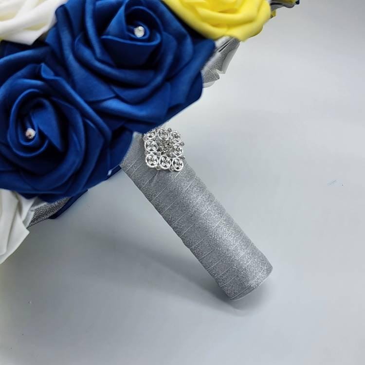 Silver handle with brooch